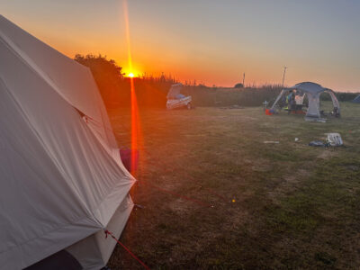Abercastle campsite is quiet, simple, with individual large pitches, a fire pit, picnic table, water supply close by, and EHU if required, with great clean plumbed-in facilities – including.